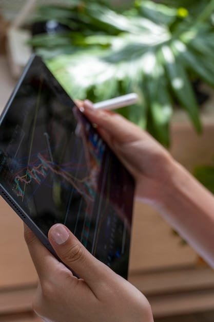 A person using a tablet to review their ESG investment portfolio, showing charts and data related to sustainability metrics.