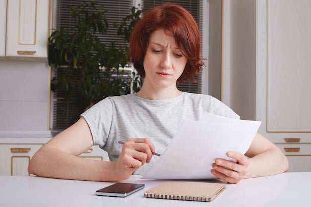 A person looking confused while filling out a form, representing the complexities and potential pitfalls of student loan forgiveness applications. The image has a slightly desaturated color scheme.