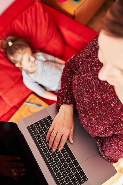 A single mom using a laptop at home, researching online resources for financial assistance and part-time job opportunities.