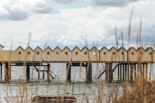 A house elevated on stilts near the coastline, showcasing a proactive measure taken to adapt to rising sea levels and protect the property from flooding.
