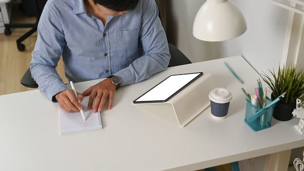 An image of a serious person looking at a financial chart on a tablet while sitting in a modern, minimalist home office setup