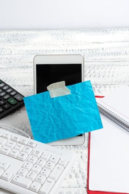 A close-up of a calculator and financial documents, with a small UBI-branded card resting on top, illustrating financial planning affected by UBI.