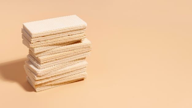 A split image showing a heap of discarded plastic credit cards on one side and a field of wheat used to make biodegradable credit cards on the other, symbolizing the contrast between traditional and sustainable materials.