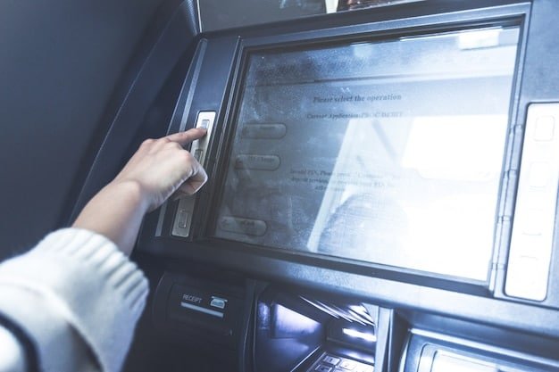 A person carefully examining an ATM card slot with a magnifying glass, checking for any signs of tampering or an attached skimming device. The background is blurred to focus on the act of inspection.