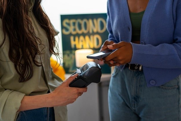 A person using a mobile wallet app on their smartphone to make a payment at a point-of-sale terminal. The focus is on the phone screen and the contactless payment symbol.