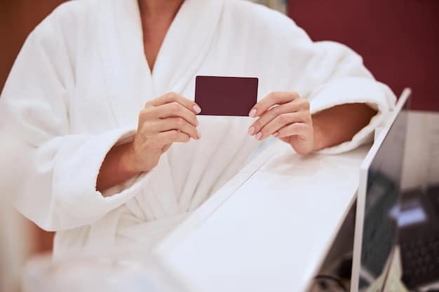 A person using a credit card to pay for a hotel room, highlighting the convenience and benefits of travel rewards.