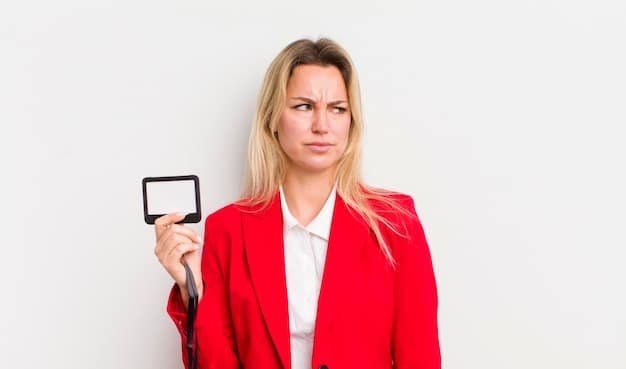 A magnifying glass focusing on the fine print of a credit card agreement, highlighting the importance of reading terms and conditions, with a worried expression on a person's face in the background.