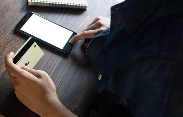 A close-up shot of a smartphone displaying a fraud alert notification, with blurred text in the background suggesting a credit card statement. The image aims to highlight the use of technology for fraud prevention.