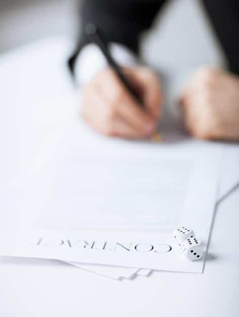 A close-up of a contract with a pen resting on top, highlighting the importance of carefully reviewing and understanding the terms of an agreement before signing. The background is blurred to keep the focus on the contract details.