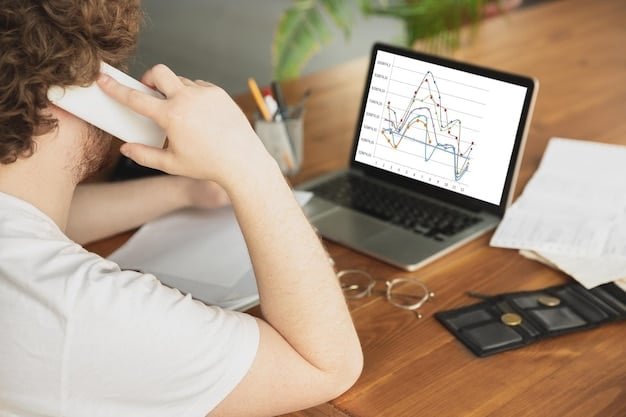 A laptop showing a graph of rising debt alongside a person looking concerned while holding their head.